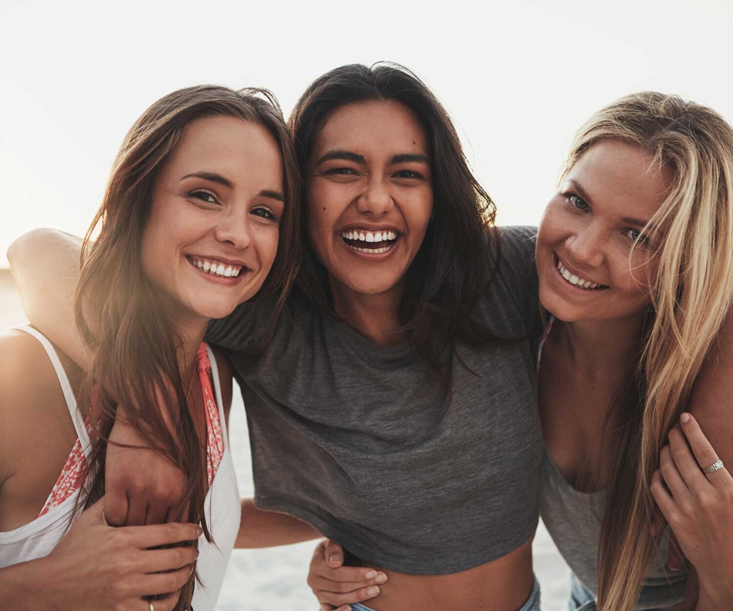 Three girlfriends spending time on the beach