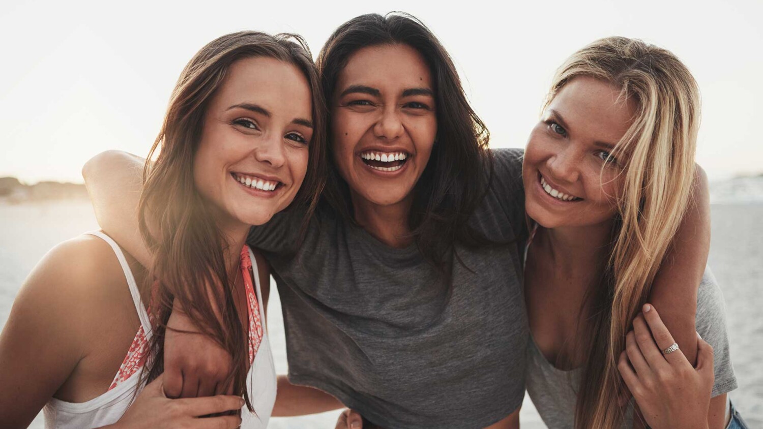 Three girlfriends spending time on the beach